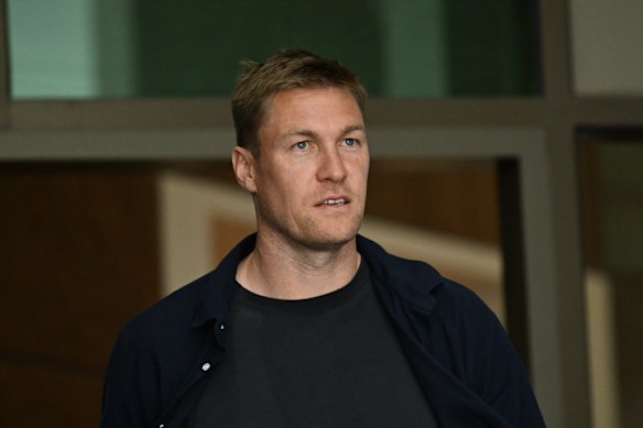 Melbourne footballer Tom McDonald leaves court after giving evidence.