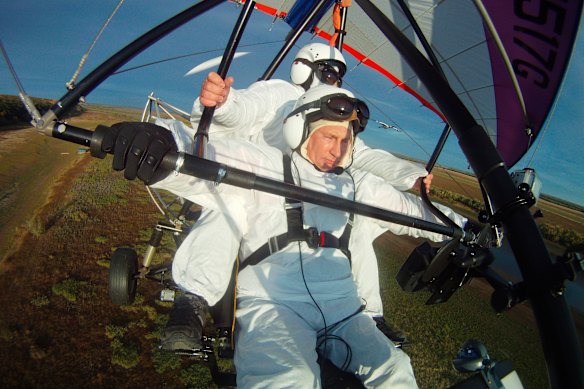 The Russian president takes to the skies in a hang-glider in 2017.