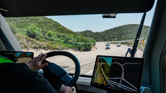 Tesla’s Semi has screens on either side of the steering wheel that provide a view of the traffic around the vehicle