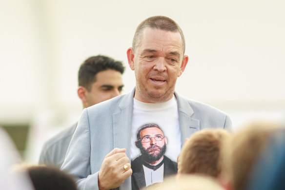 Raymond Wood speaks to a room of football hopefuls.