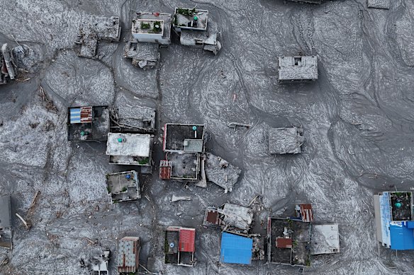 An aerial view shows debris and mud covering an area in Devighat village, Nepal.