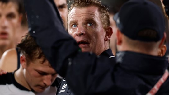 Michael Voss addresses his troops in their clash with the Crows.