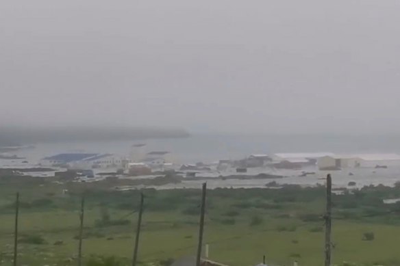 In this image taken from a video released by Geophysical Service of the Russian Academy of Sciences, shows the aftermath of tsunami hitting the coastal area of Severo-Kurilsk at Paramushir island of Kuril Islands, Russia.