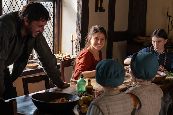 Paul Mescal as William Shakespeare, Jessie Buckley as Agnes and Bodhi Rae Breathnach as Susanna before tragedy strikes in Hamnet.