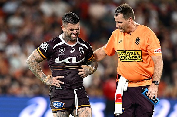 Adam Reynolds leaves the field injured.