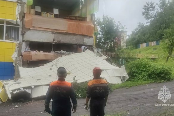 In this image taken from a video released by Russian Emergency Ministry Press Service, rescuers inspect a kindergarten damaged by an earthquake in Petropavlovsk-Kamchatsky, Russia.