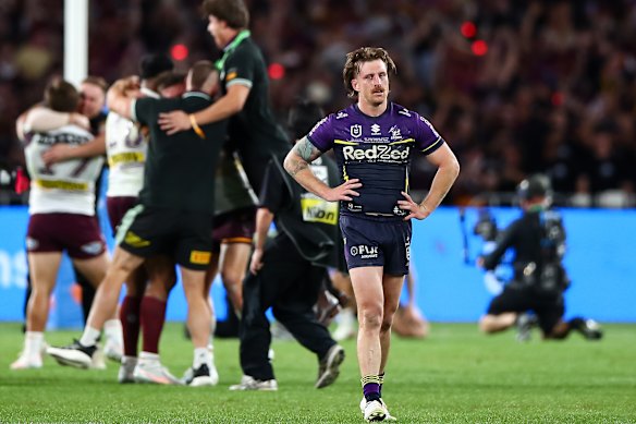 Brisbane celebrate a remarkable grand final win as Cameron Munster walks away on Sunday.