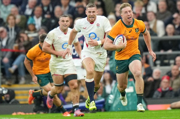 Australia’s Harry Potter smiles as he races in to score a try.