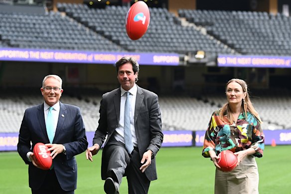 McKenna in 2022 with (from left) Foxtel CEO Patrick Delany and then AFL CEO Gillon McLachlan, following a record $4.5 billion broadcast deal.