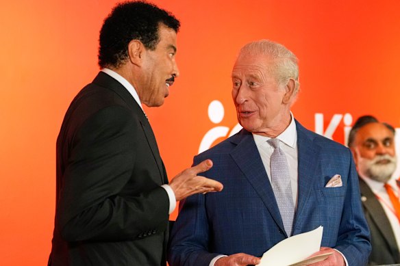 Singer Lionel Richie meets the King, who later speculated on Richie’s vocal longevity.