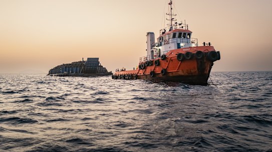 Oil tankers and cargo vessels anchored off Port Sultan Qaboos in Muscat, Oman.