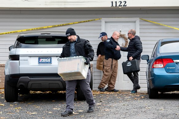 Police remove evidence from the crime scene in Moscow, Idaho. 