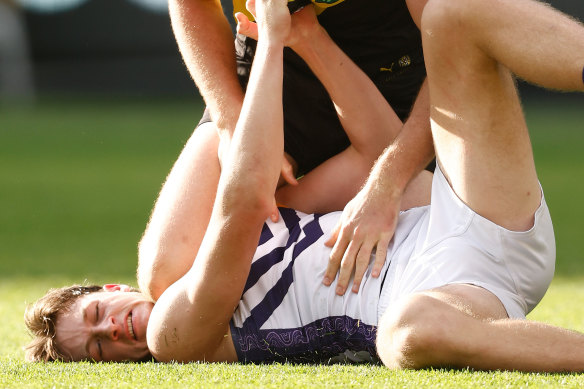 Jye Amiss of the Dockers and Ben Miller of Richmond wrestle during Sunday’s match.