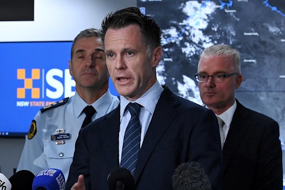 Premier Chris Minns with Mal Lanyon, right, at a press conference about Cyclone Alfred in March 2025.