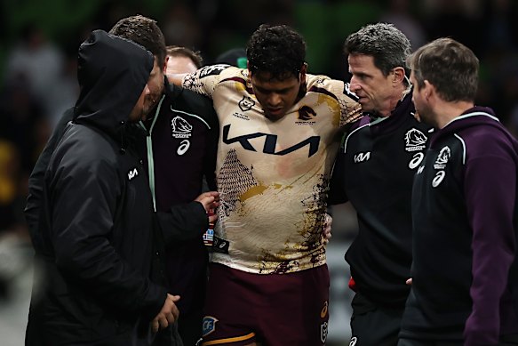 Selwyn Cobbo is assisted from the field.