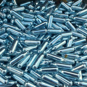 Nitrous oxide is often sold in small metal canisters.