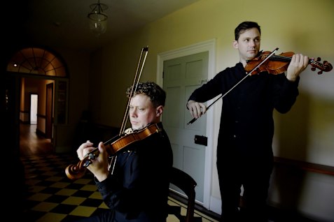 Violinists Max Holzner and Kristian Winther at Old Government House in Parramatta.