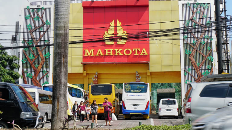 An unmarked shop selling latex products. Shoppers arrive on tour buses; the shop is not open to the general public.