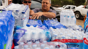 Huge amounts of bottled water have been delivered to towns hit by bushfires, as Coca-Cola Amatil's share price hits five-year highs.