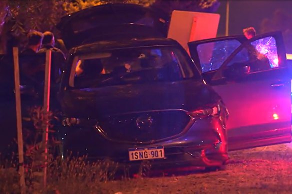 Police with a car that was involved in a pursuit through Perth’s north on Wednesday night. 