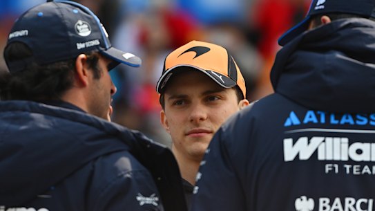Oscar Piastri talks to other drivers in Shanghai.