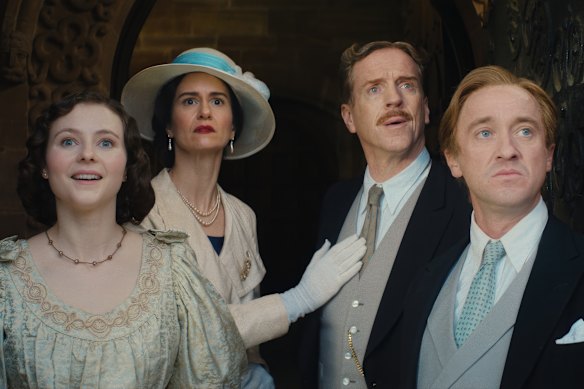 From left, Thomasin McKenzie, Katherine Waterston, Damian Lewis, and Tom Felton in Fackham Hall.