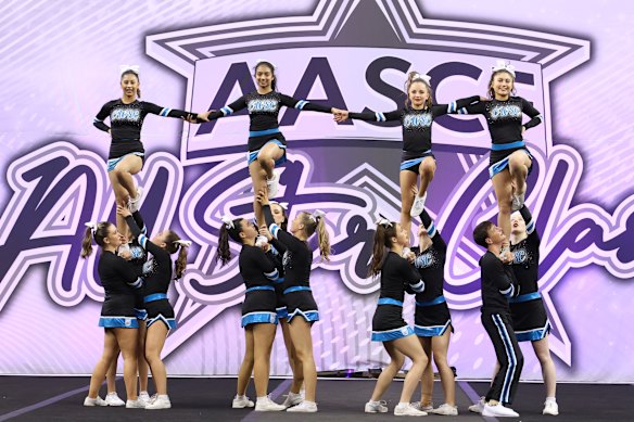 Dalyia Raj, 17, (top row, second from left) and fellow student Olivia Prasad, 16, (top row, left) both received VCE subject scores above 40 and are competitive cheerleaders.