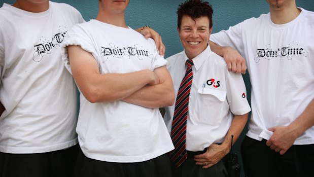 Anne Hooker, when she was youth development officer at Port Phillip Prison, with some inmates.