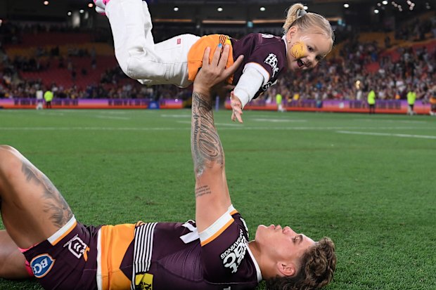 Reece Walsh celebrates with his daughter Leila after a match in 2023.