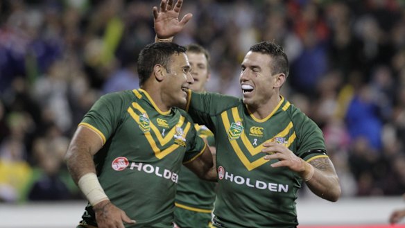 Justin Hodges and Darius Boyd celebrate a try in 2017.
