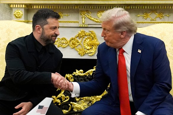 Volodymyr Zelensky shakes hands with President Donald Trump during their meeting at the White House in August.