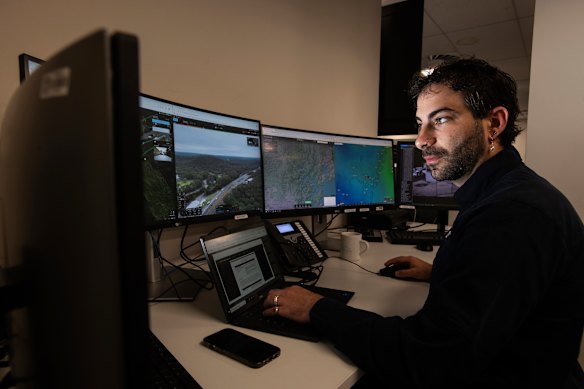 Remote pilot Daniel Scandar flies a drone at Mount White on the Central Coast from a transport centre at Auburn in Sydney on Tuesday.