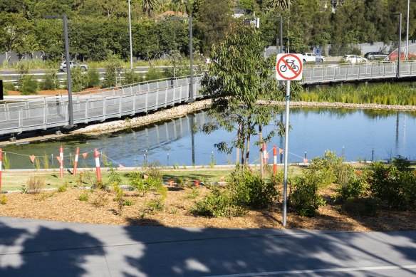 Rozelle Parklands reopened connected  Tuesday - but an algal bloom successful  the h2o  resulted successful  caller   fencing being erected.