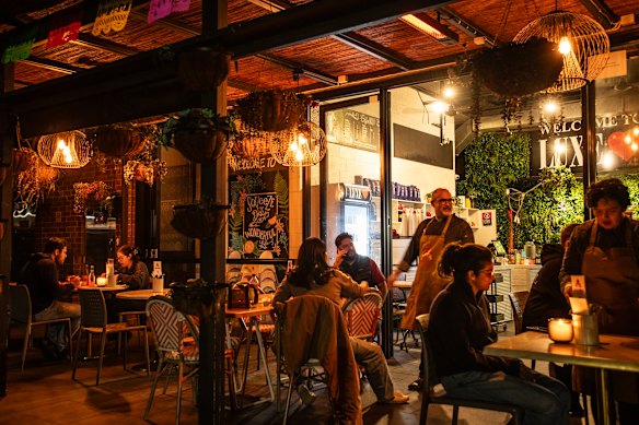 Luis Arana and partner Andrea Tenorio (far right) transform Luxe cafe to serve Adobo Tacos’ diners several nights a week.