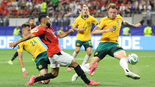 Harry Souttar attempts to block Egypt’s Mo Salah.