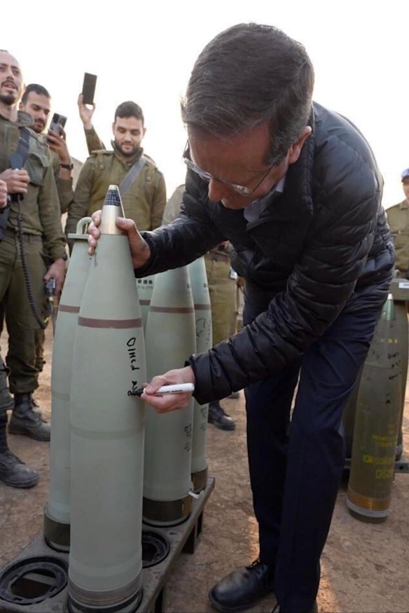 Israeli President Isaac Herzog was criticised for signing a bomb that may have been used in Gaza. The image was widely shared on social media. He says he signed a “smokescreen shell”.