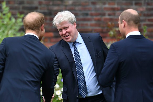 Earl Spencer, centre, is greeted by his nephews, princes Harry and William, at Kensington Palace in London in 2021.