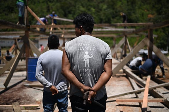 A member of the Awa Indigenous community wears a Hanrine T-shirt during a communal labour meet-up known as a “minga” in Palmira de Toctemí, a community in the Awa’s ancestral land in La Merced de Buenos Aires parish.