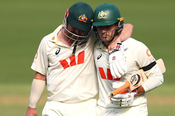 Best mates Head and Alex Carey leave the Adelaide Oval turf on day three, arm in arm.