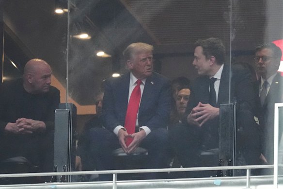 President Donald Trump and Elon Musk talk at a memorial for Charlie Kirk.