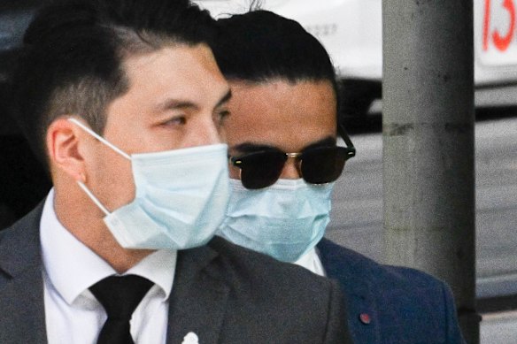 Ho, pictured in sunglasses in November, pleaded guilty to using a carriage service to groom a child and possessing child abuse material.