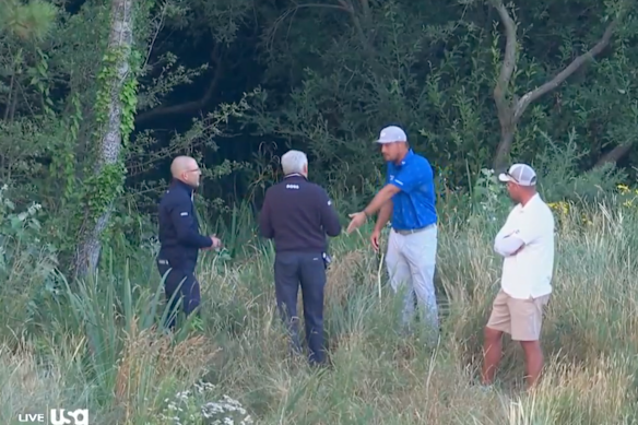 Bryson DeChambeau speaks with officials after his round on Friday at the British Open. 