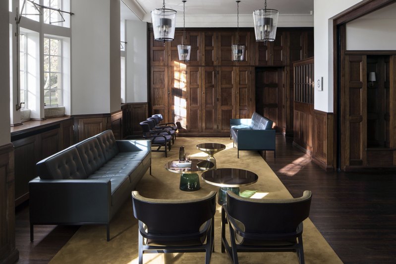 An interior suite at BMA House features many of its original features, including timber panelling.