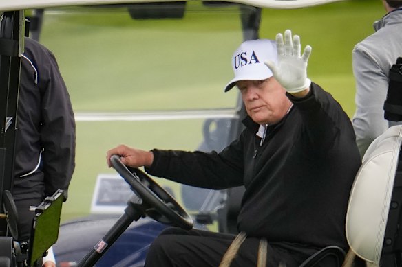 US President Donald Trump plays golf at his Turnberry course in Scotland on Saturday.