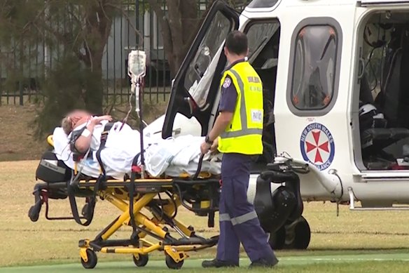 The woman is airlifted to hospital after the alleged attack.