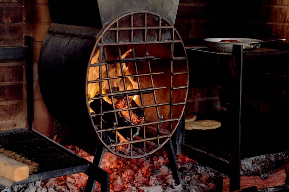 Flatbread and lamb are just some of the dishes cooked over the woodfire coals at Isme.