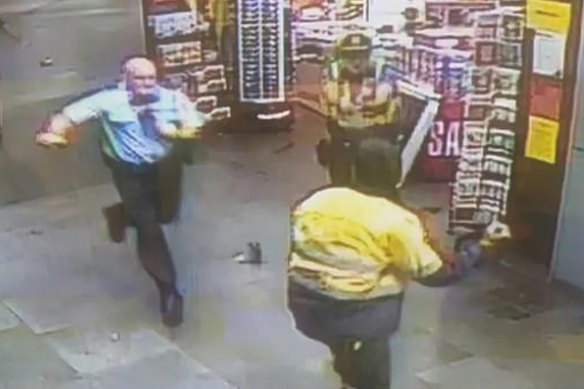 Clifford Hagart running towards the armed man.