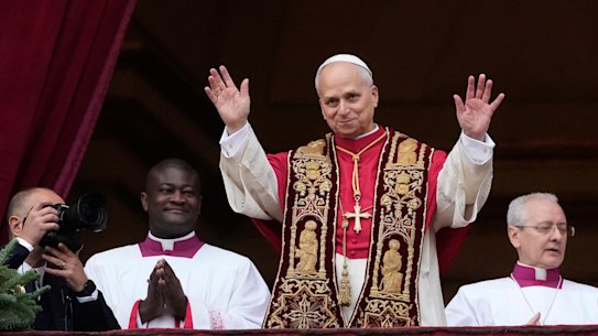Pope Leo XIV waves after delivering the Urbi et Orbi (‘to the city and to the world’ ) Christmas’ day blessing from the main balcony of St Peter’s Basilica at the Vatican.