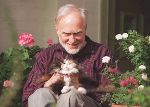 Nigel Butterley at home with his cat Hildegard in 1995.
