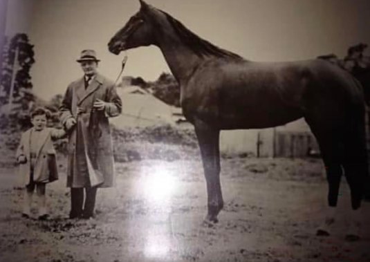 Charlie pictured as a child with champion racehorse Tranquil Star.